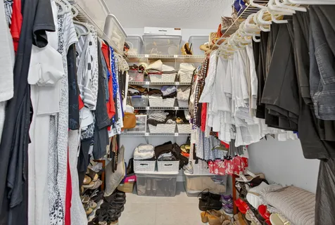 a living room with patio furniture and a large window