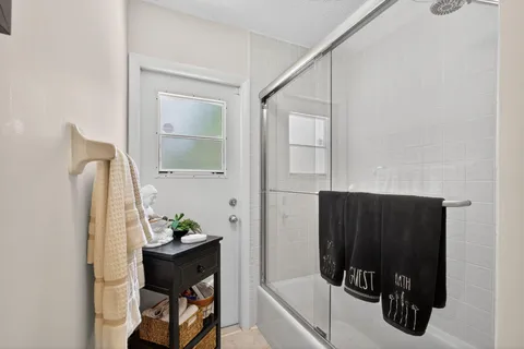 a view of a chair and table in the garden