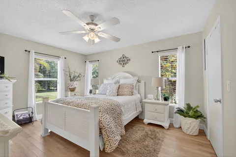 a view of yard with swimming pool and green space