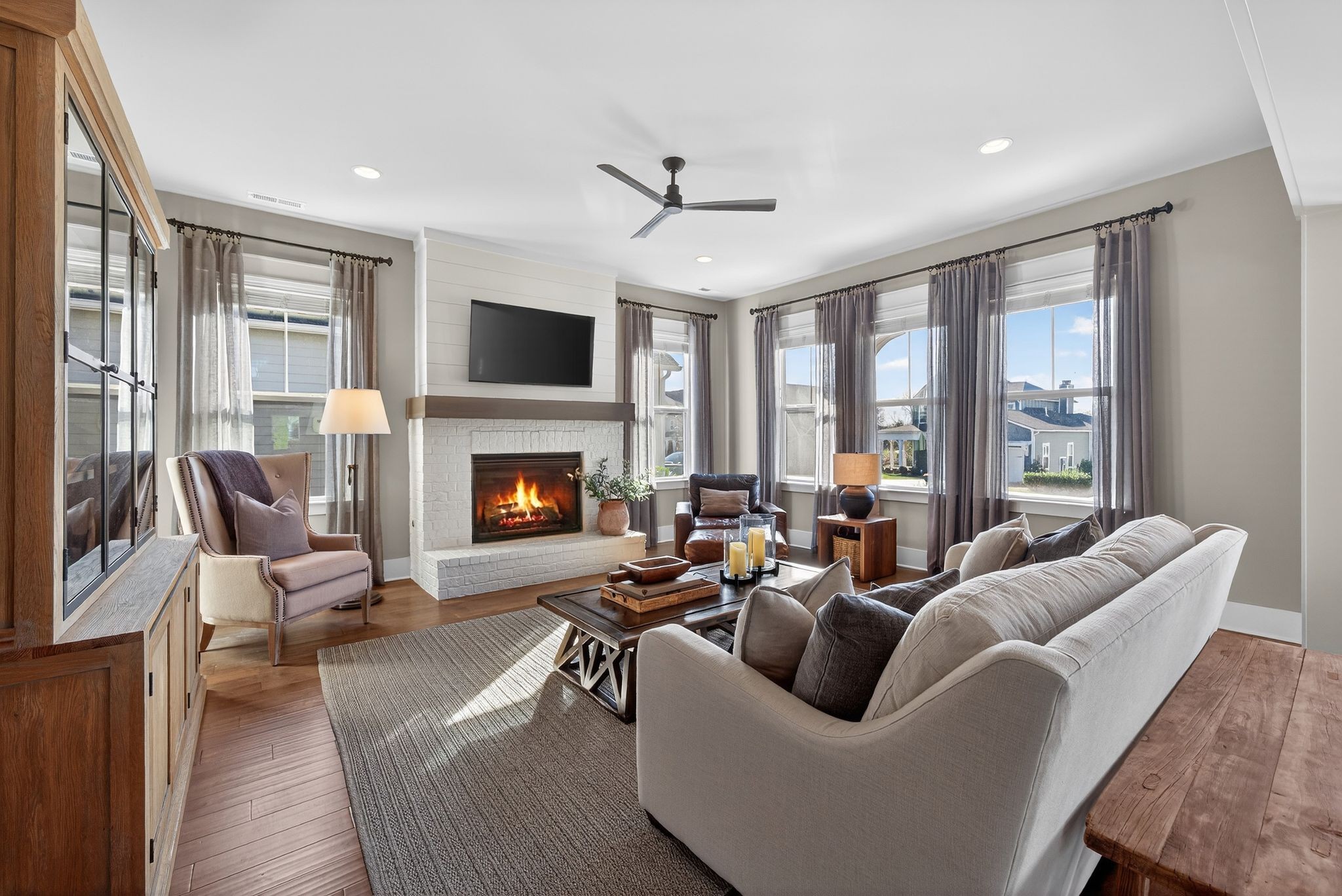 998 Spruce Ridge Lane Spring Hill, TN 37174 - Photo 17 of 82 a living room with furniture fireplace and a flat screen tv