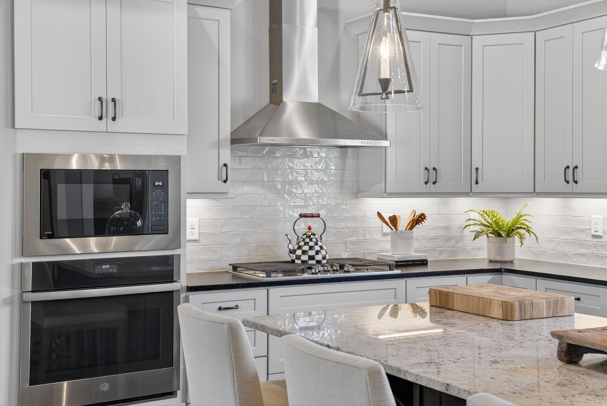 998 Spruce Ridge Lane Spring Hill, TN 37174 - Photo 25 of 82 a kitchen with granite countertop a stove a sink and a white cabinets