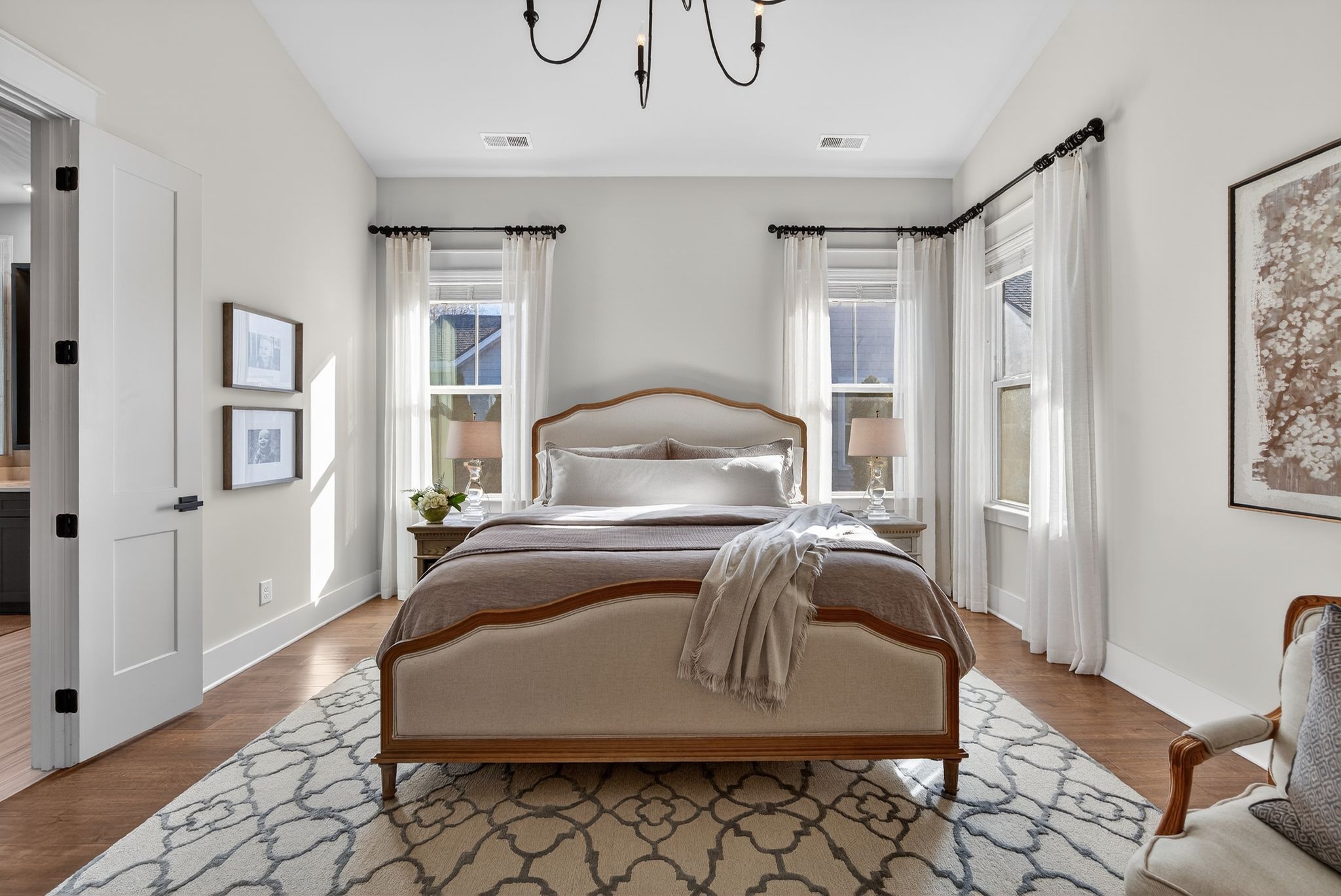 998 Spruce Ridge Lane Spring Hill, TN 37174 - Photo 39 of 82 a bedroom with a bed and wooden floor