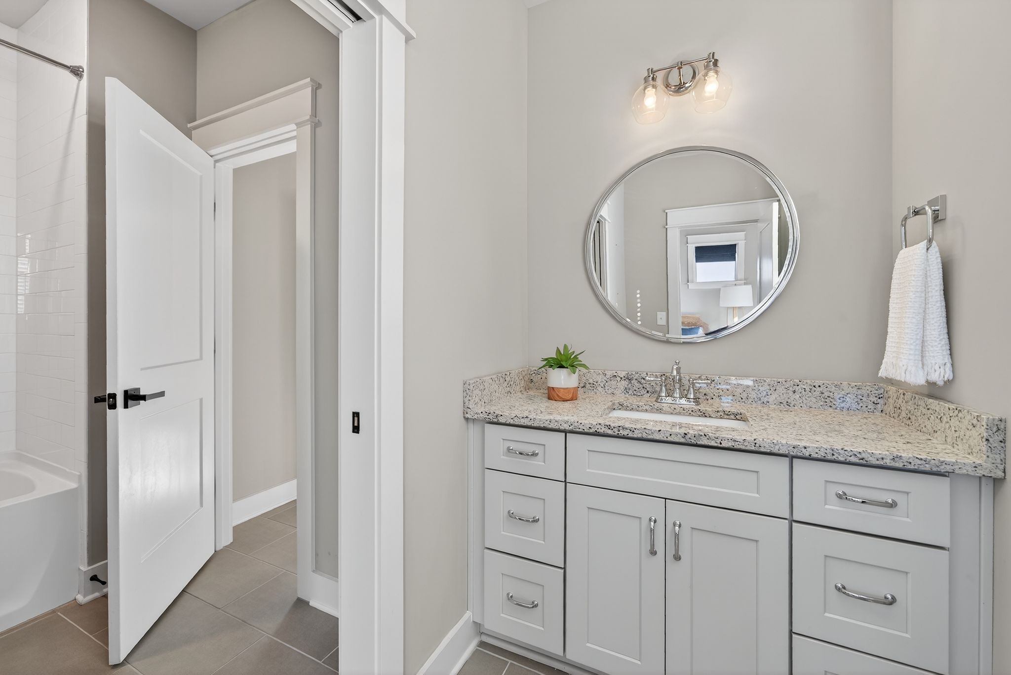 998 Spruce Ridge Lane Spring Hill, TN 37174 - Photo 53 of 82 a bathroom with a granite countertop sink a mirror and vanity