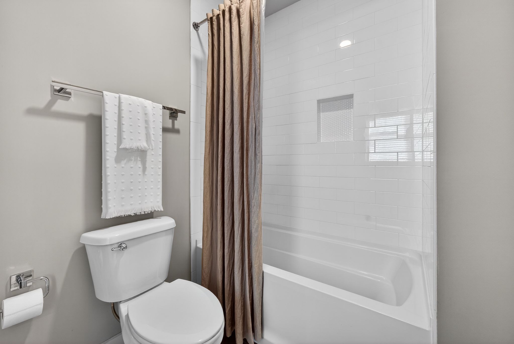 998 Spruce Ridge Lane Spring Hill, TN 37174 - Photo 55 of 82 a white toilet sitting next to a bathroom sink and tub