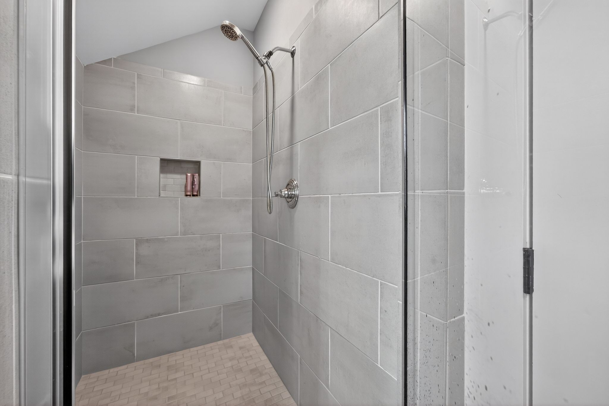 998 Spruce Ridge Lane Spring Hill, TN 37174 - Photo 61 of 82 a bathroom with a glass shower door