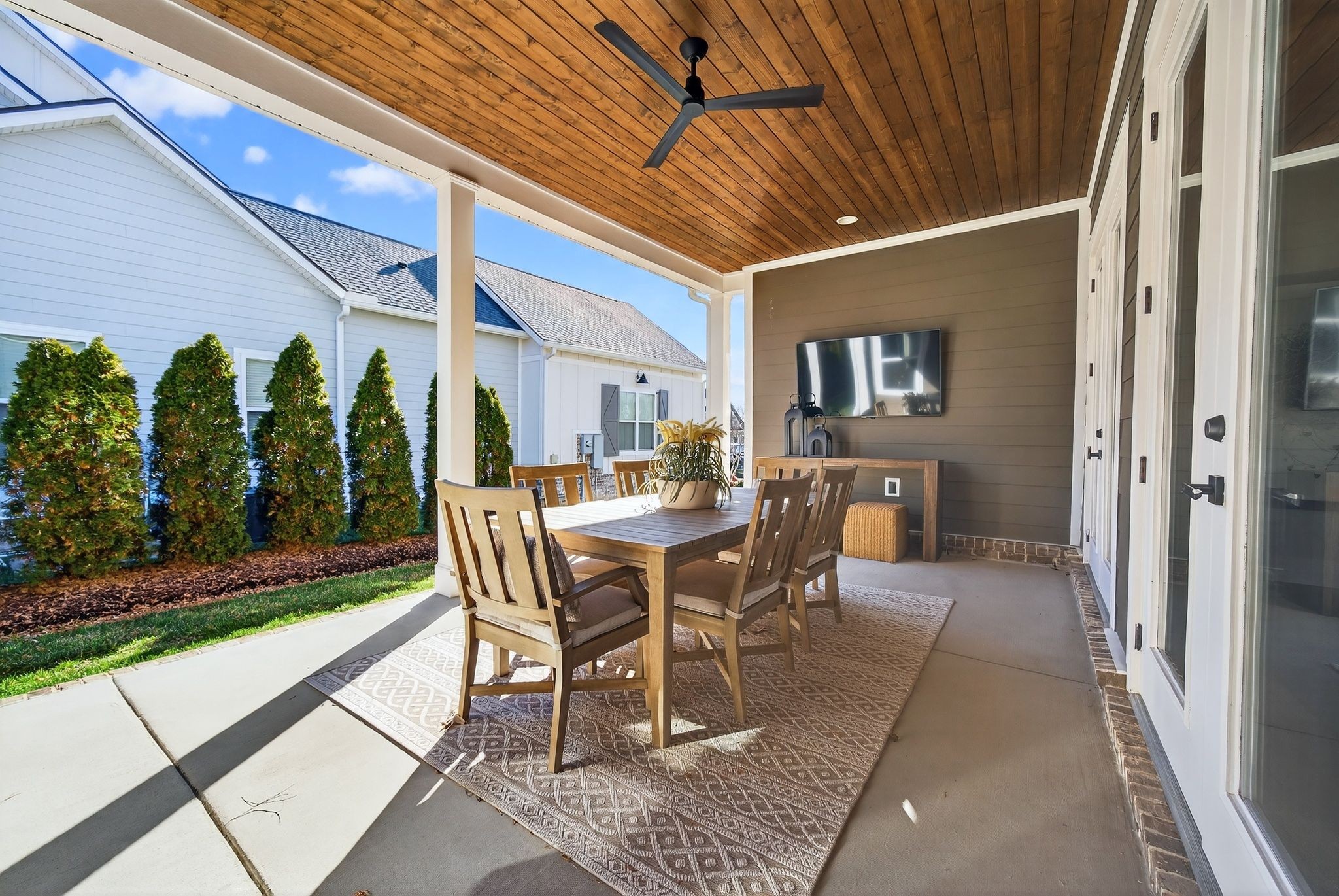 998 Spruce Ridge Lane Spring Hill, TN 37174 - Photo 68 of 82 a view of a patio with a table and chairs and potted plants
