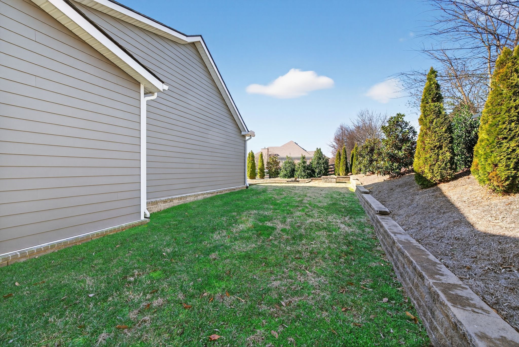 998 Spruce Ridge Lane Spring Hill, TN 37174 - Photo 72 of 82 a view of a backyard with plants and a garden