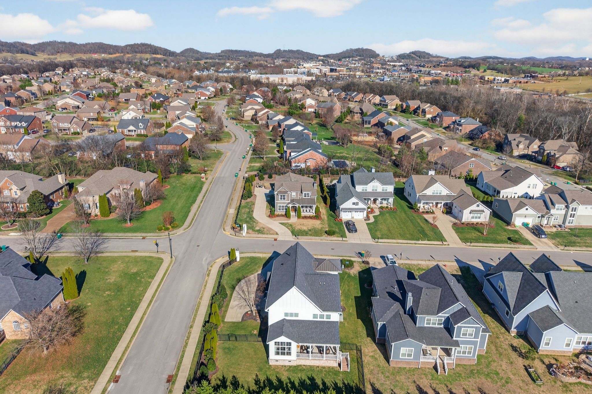 998 Spruce Ridge Lane Spring Hill, TN 37174 - Photo 80 of 82 an aerial view of residential houses with outdoor space and a lake view