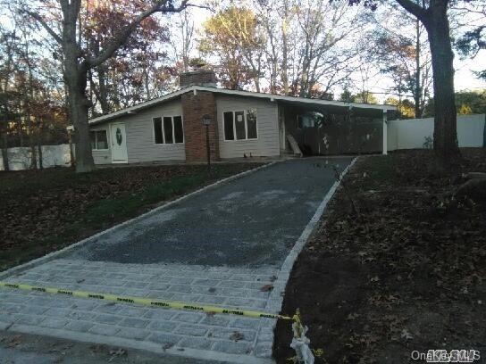 1 Foxboro Road Hampton Bays, NY 11946 - Photo 1 of 1 a backyard of a house with lots of green space