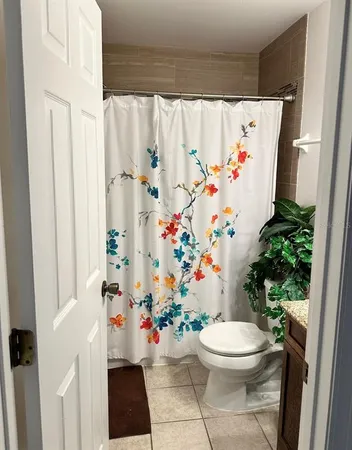 a bathroom with a sink and a curtain