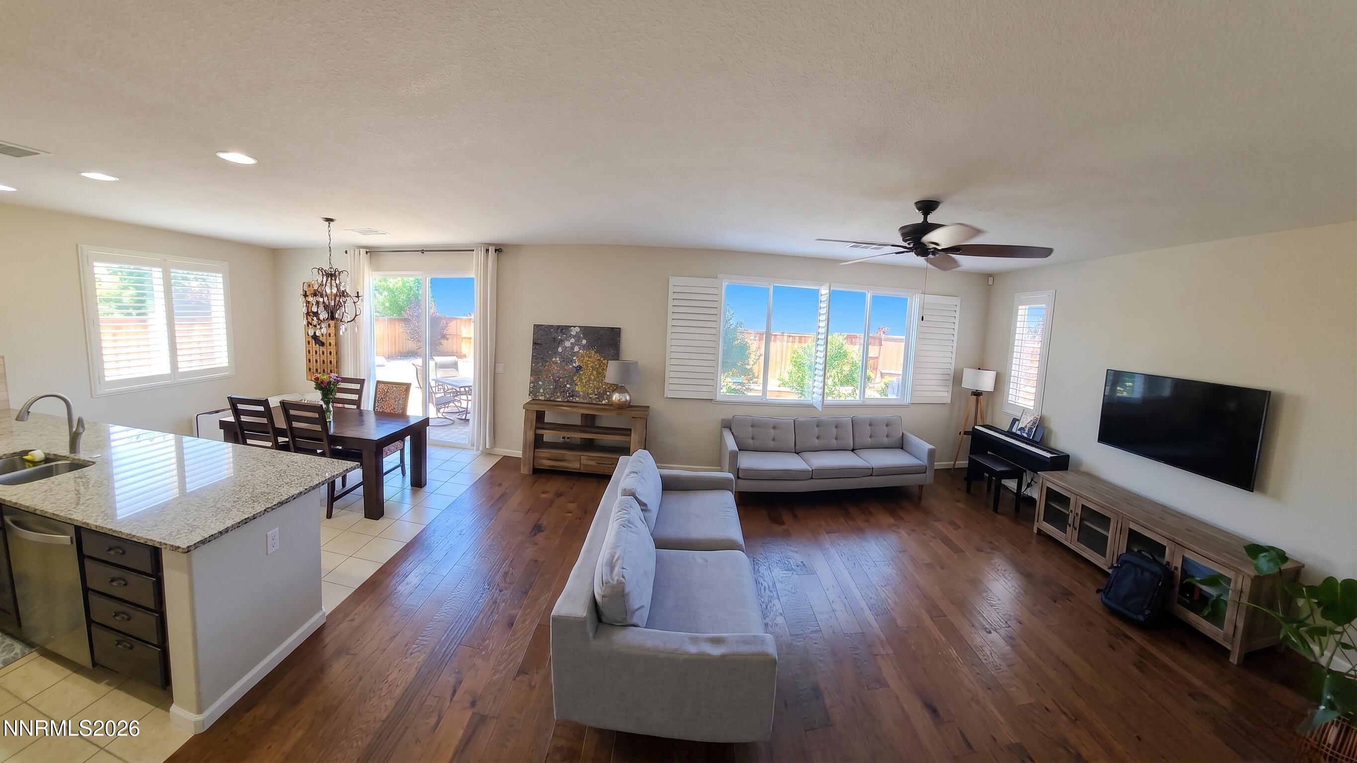 2775 Bonfire Lane Reno, NV 89521 - Photo 8 of 41 a living room with furniture and a flat screen tv
