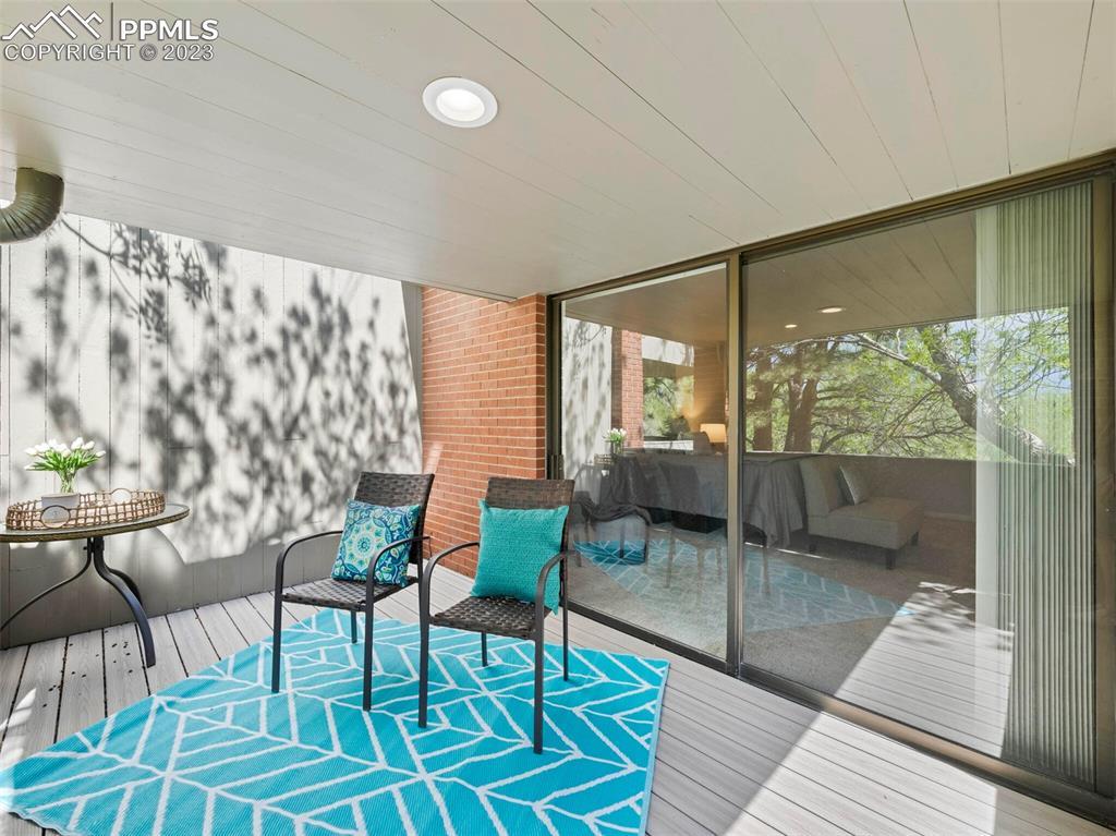 2622 Spring Grove Terrace Colorado Springs, CO 80906 - Photo 11 of 37 a living room with furniture and a floor to ceiling window