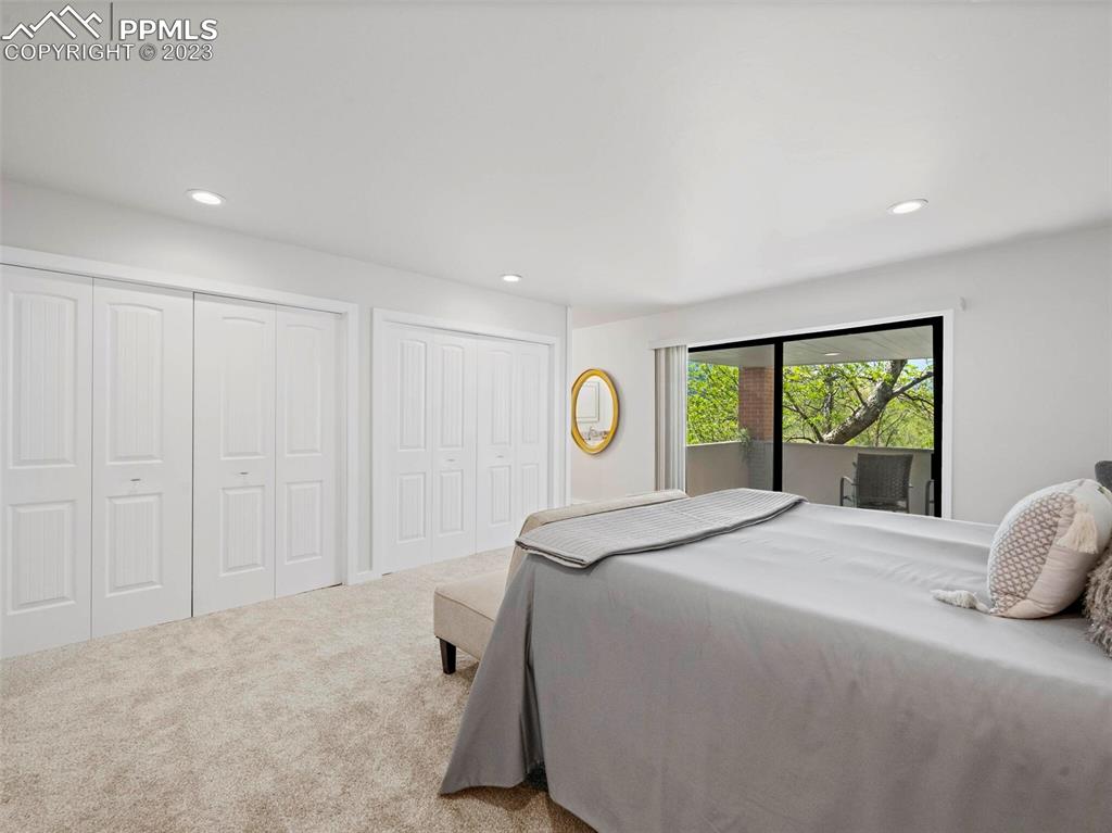 2622 Spring Grove Terrace Colorado Springs, CO 80906 - Photo 13 of 37 a spacious bedroom with a bed and a window