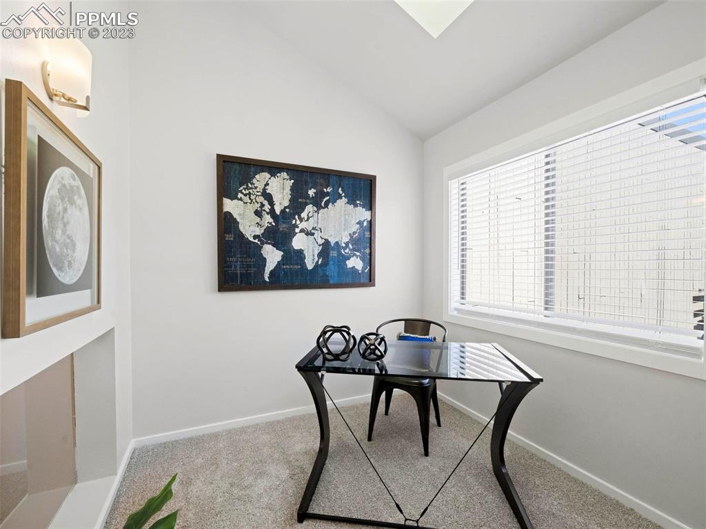 2622 Spring Grove Terrace Colorado Springs, CO 80906 - Photo 16 of 37 a view of a dining room with furniture and a window