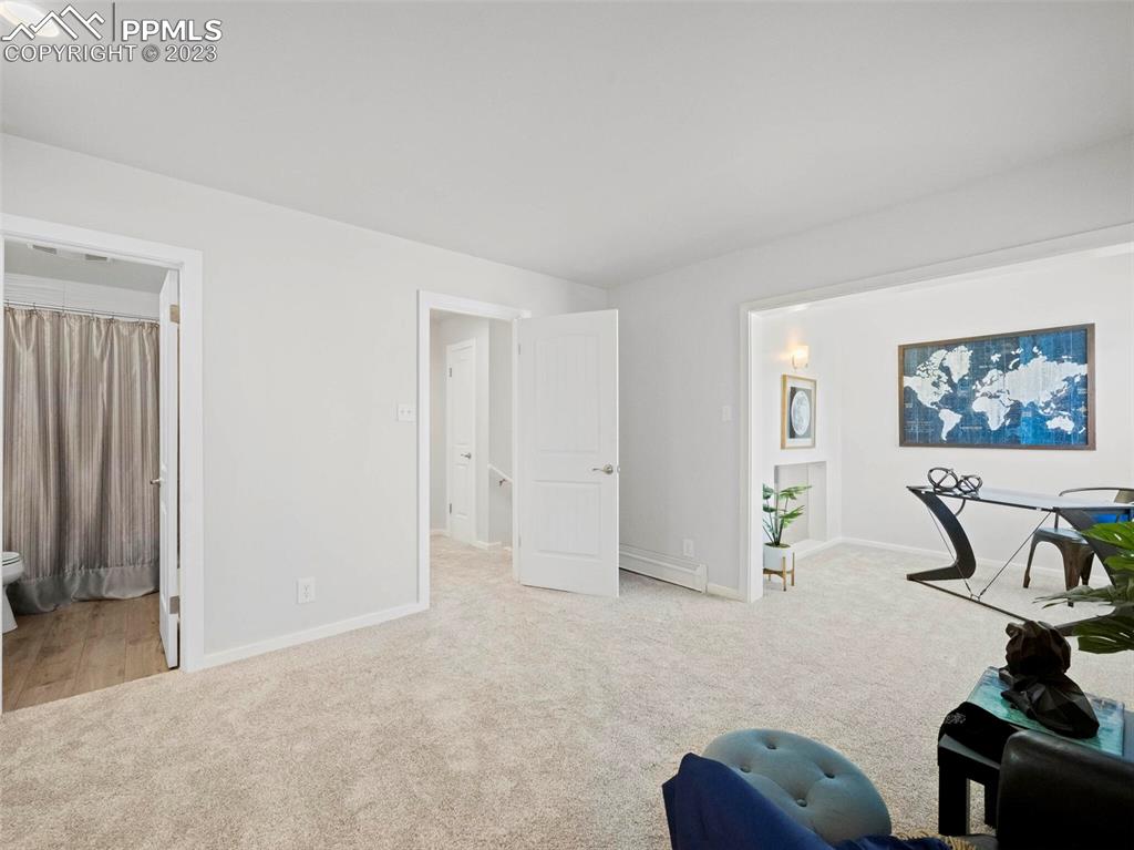 2622 Spring Grove Terrace Colorado Springs, CO 80906 - Photo 17 of 37 a view of room with projector and furniture