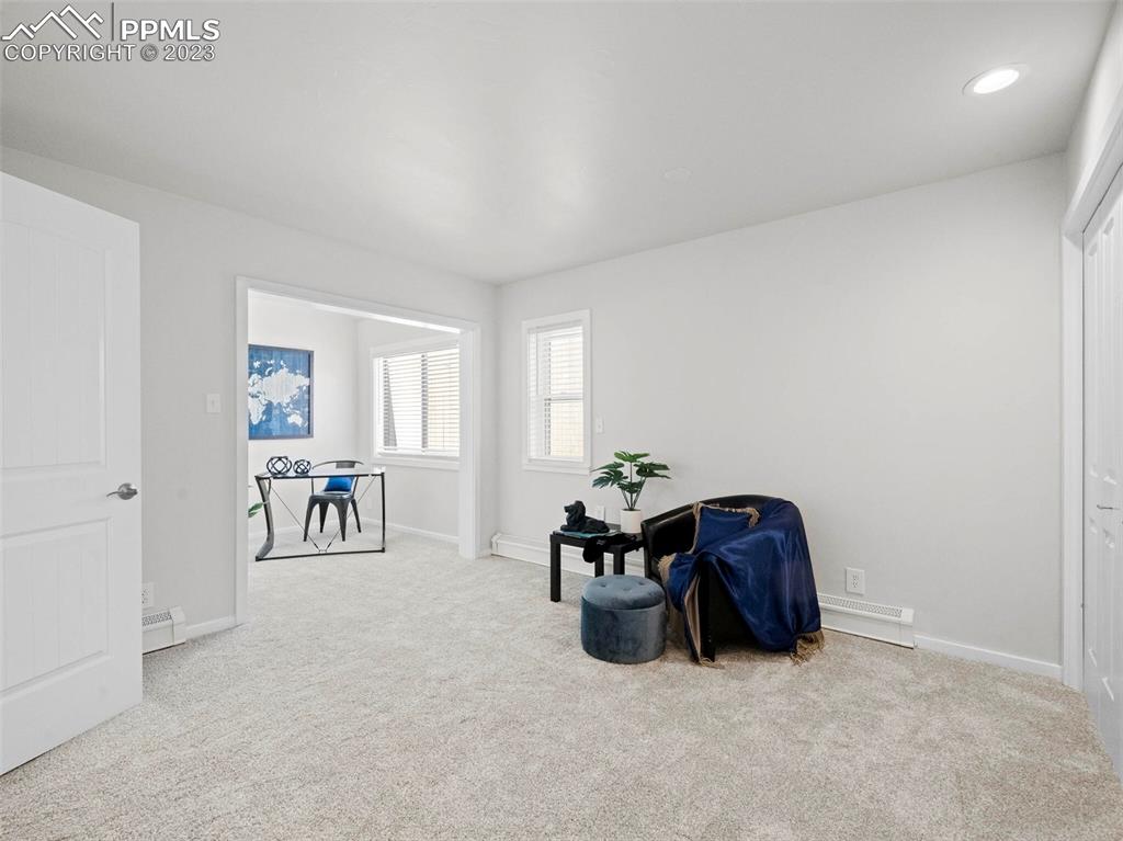 2622 Spring Grove Terrace Colorado Springs, CO 80906 - Photo 20 of 37 a living room with furniture and a table