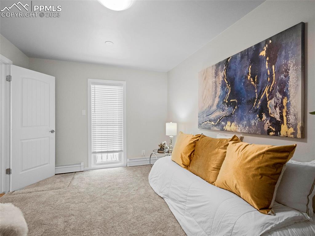 2622 Spring Grove Terrace Colorado Springs, CO 80906 - Photo 21 of 37 a living room with a couch