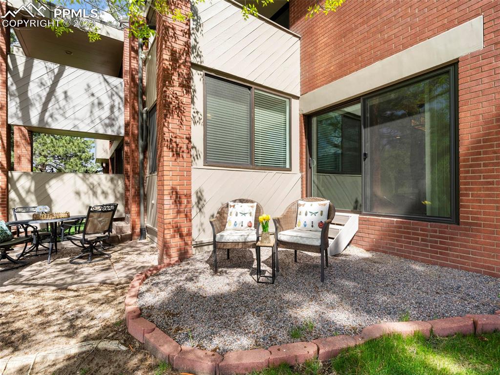 2622 Spring Grove Terrace Colorado Springs, CO 80906 - Photo 25 of 37 a bench sitting in front of a house