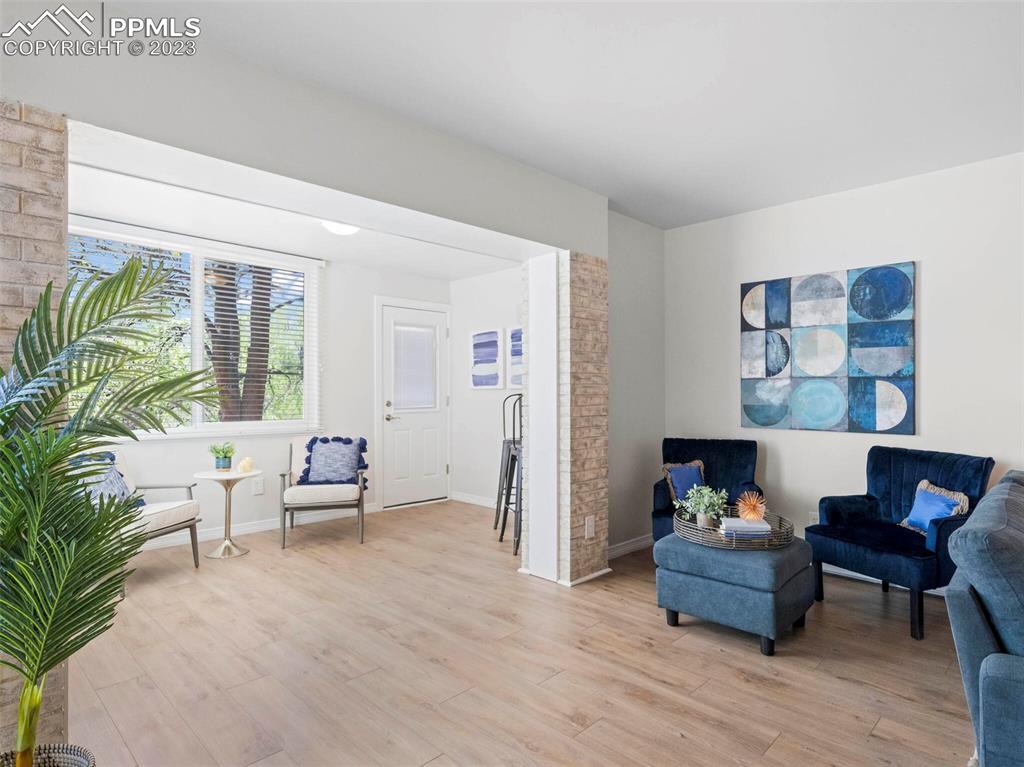 2622 Spring Grove Terrace Colorado Springs, CO 80906 - Photo 32 of 37 a living room with furniture and a potted plant