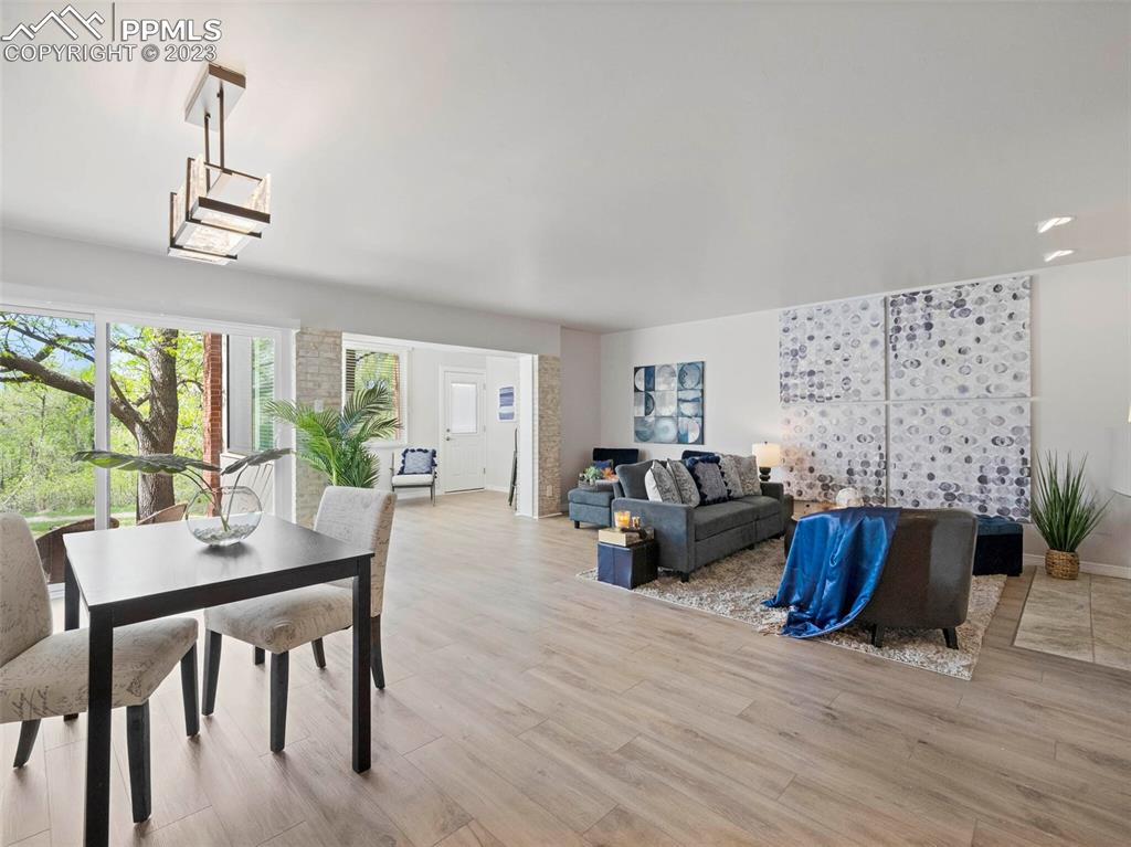 2622 Spring Grove Terrace Colorado Springs, CO 80906 - Photo 4 of 37 a living room with furniture and a wooden floor