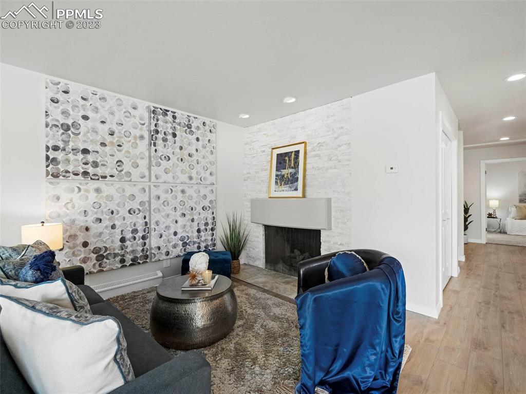 2622 Spring Grove Terrace Colorado Springs, CO 80906 - Photo 9 of 37 a living room with furniture and a fireplace