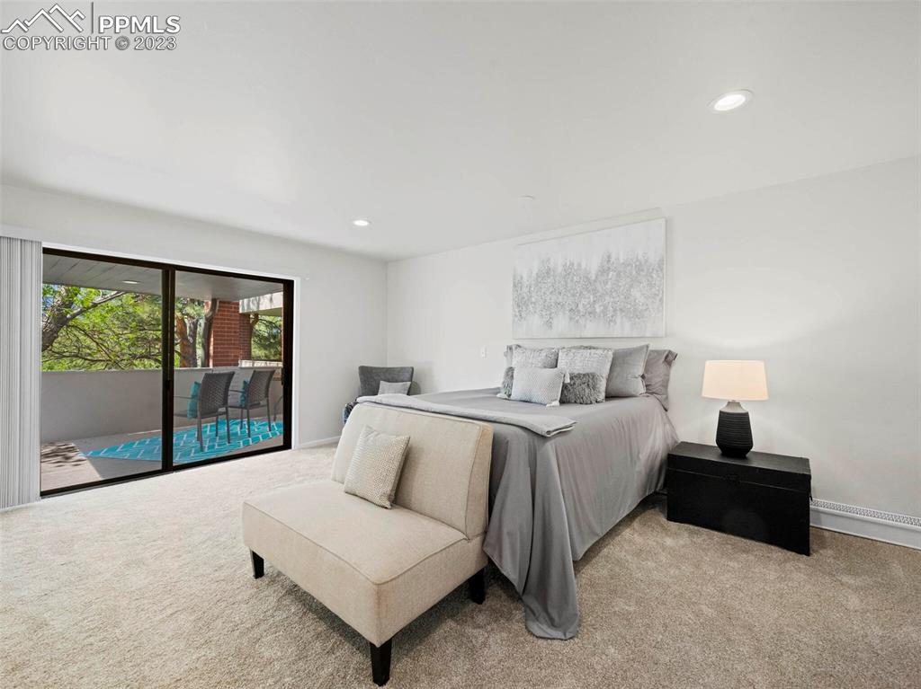 2622 Spring Grove Terrace Colorado Springs, CO 80906 - Photo 10 of 37 a bedroom with bed and large window