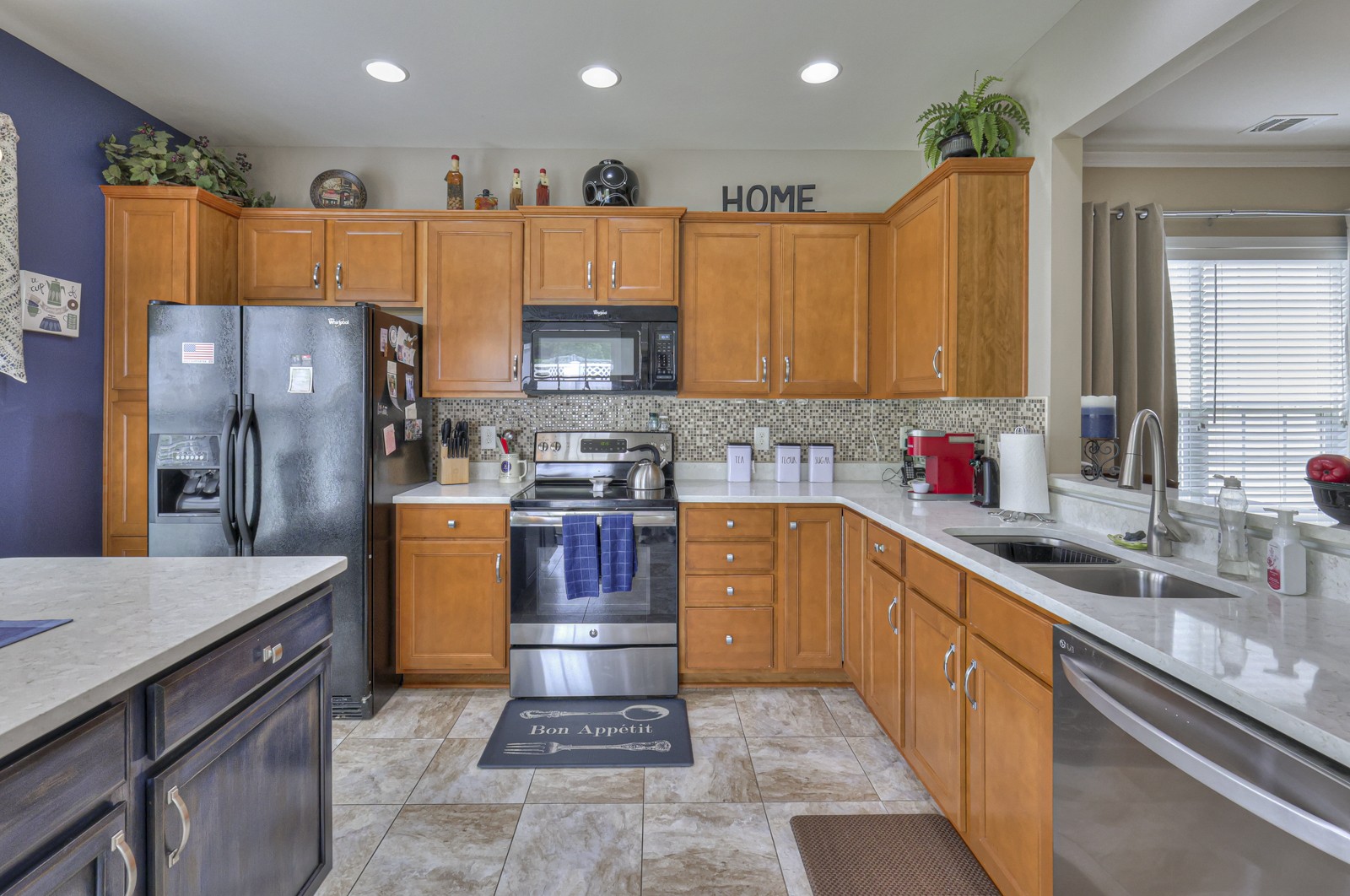 411 Independence Street Mount Juliet, TN 37122 - Photo 17 of 39 a kitchen with stainless steel appliances granite countertop a sink refrigerator and cabinets