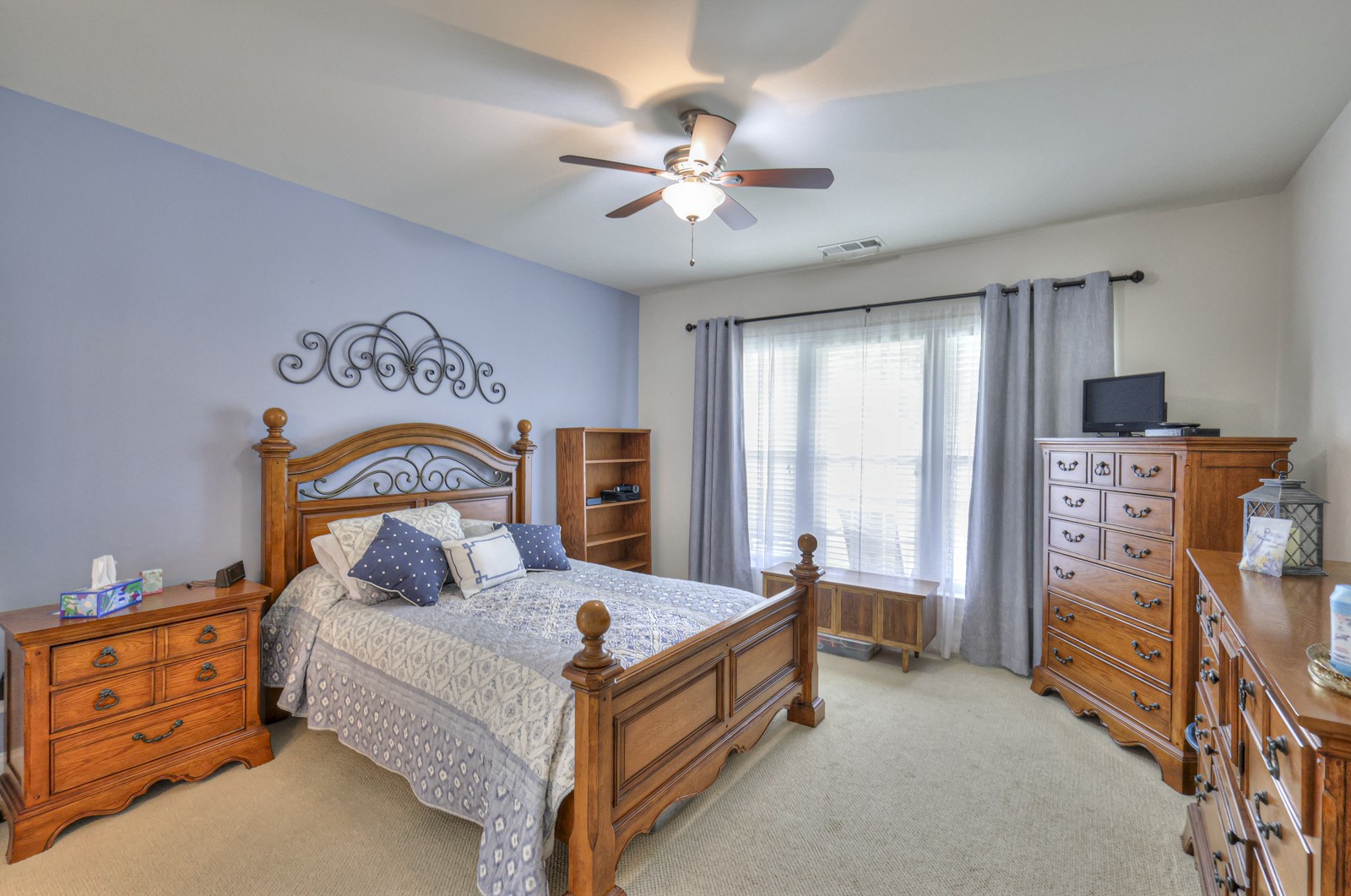 411 Independence Street Mount Juliet, TN 37122 - Photo 19 of 39 a bedroom with bed and a chandelier