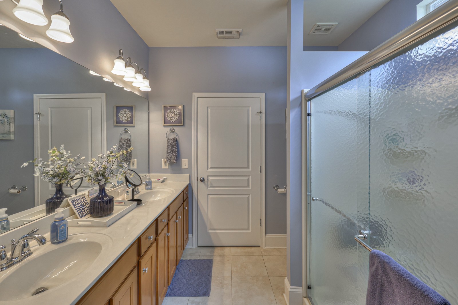 411 Independence Street Mount Juliet, TN 37122 - Photo 21 of 39 a bathroom with a double vanity sink and a mirror