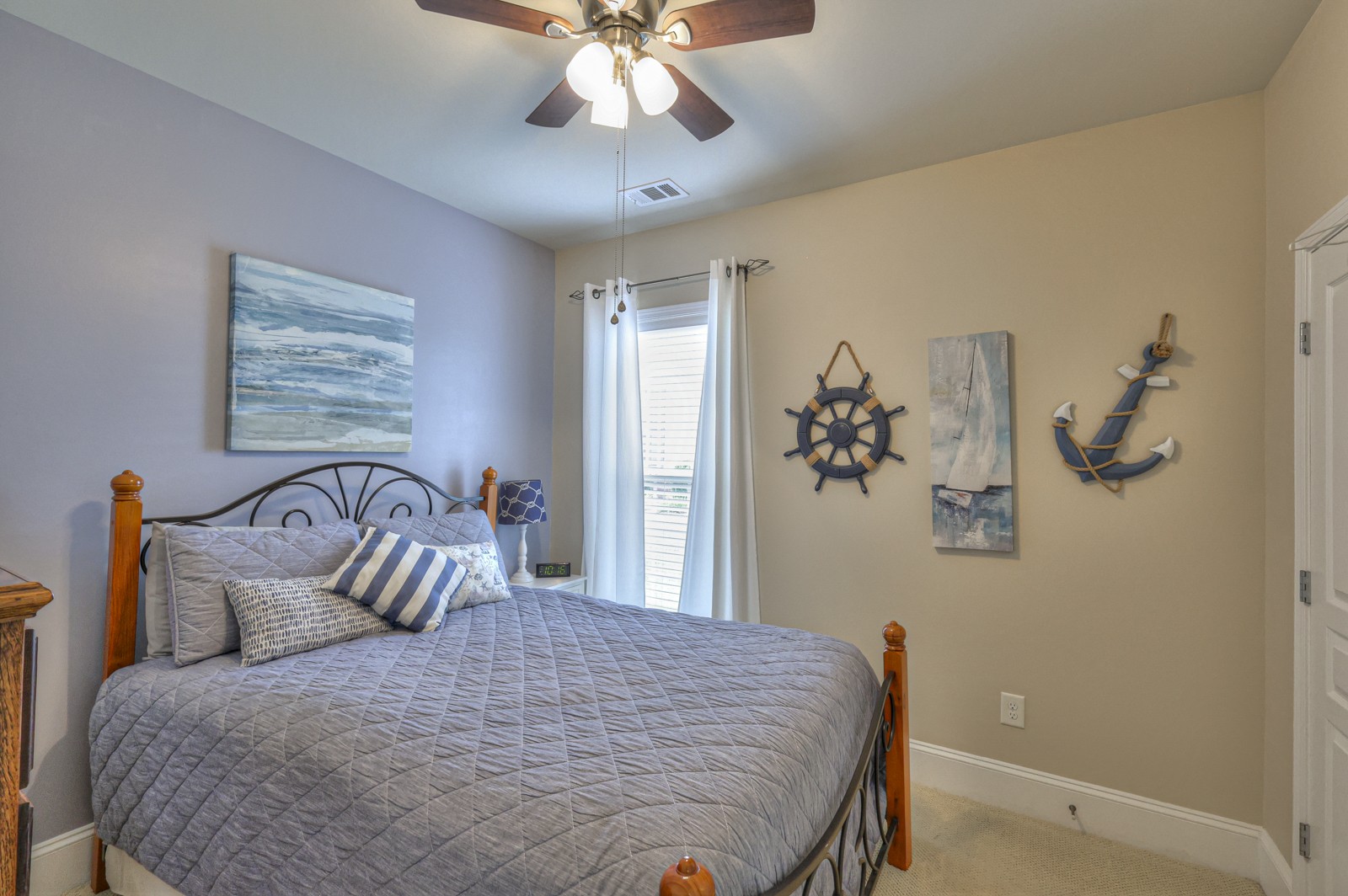 411 Independence Street Mount Juliet, TN 37122 - Photo 24 of 39 a bedroom with a bed and a chandelier