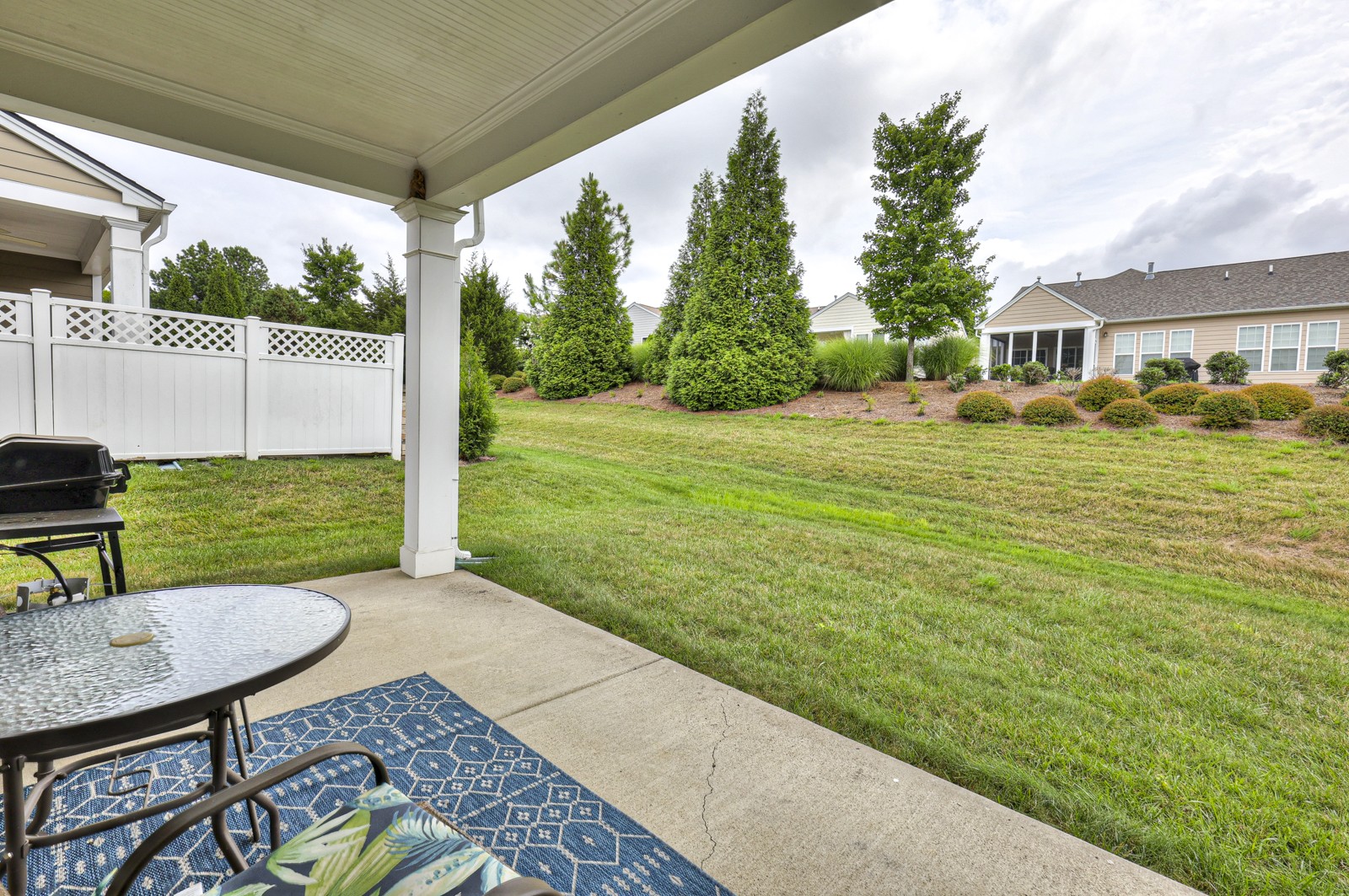 411 Independence Street Mount Juliet, TN 37122 - Photo 30 of 39 a view of a backyard with table and chairs and wooden fence