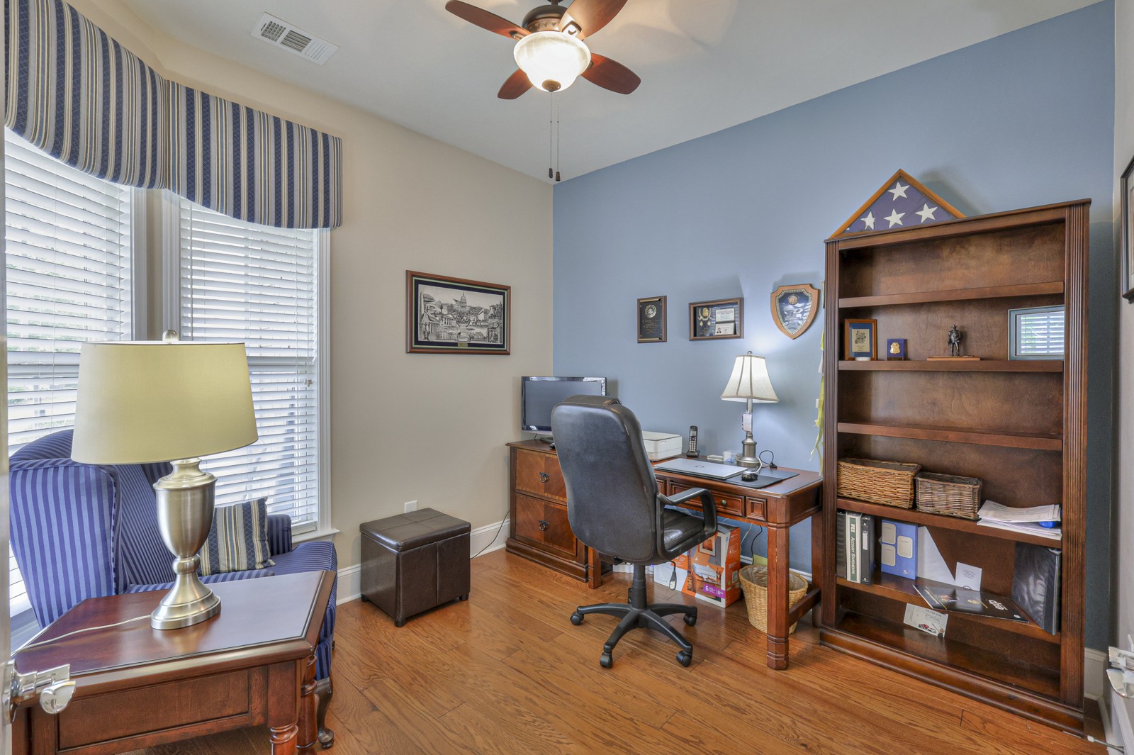 411 Independence Street Mount Juliet, TN 37122 - Photo 5 of 39 a workspace with furniture and a lamp