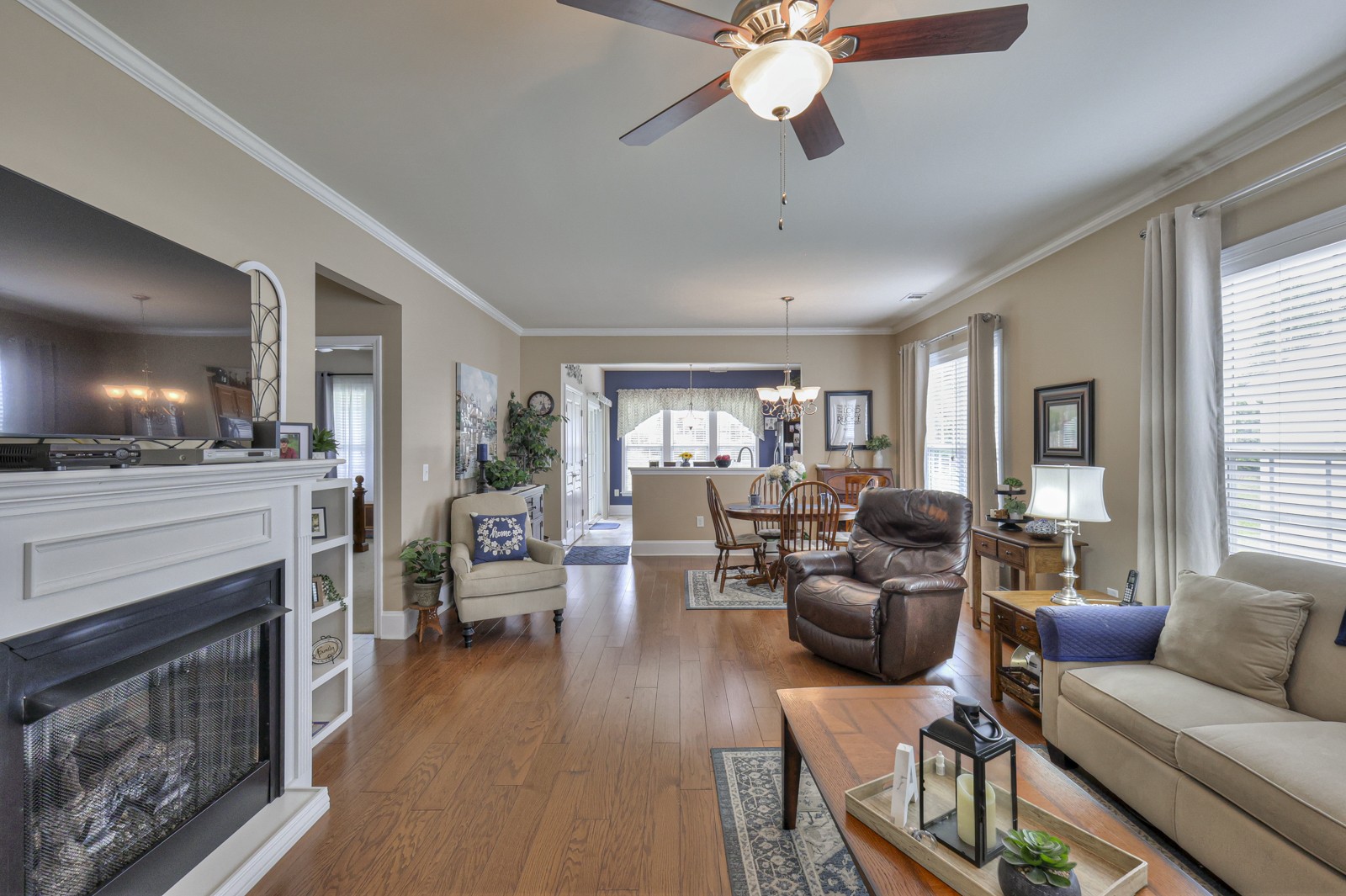 411 Independence Street Mount Juliet, TN 37122 - Photo 8 of 39 a living room with furniture a fireplace and a flat screen tv