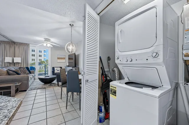 a view of a livingroom with furniture and windows