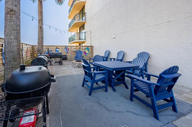 a view of balcony with wooden floor and seating space