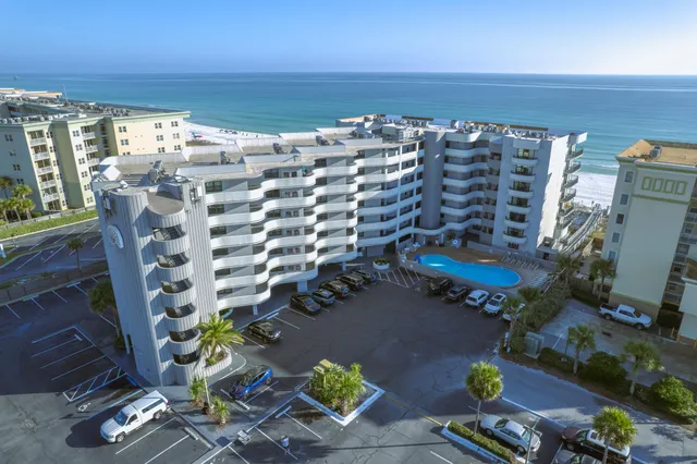 a view of a living room with furniture and garden view