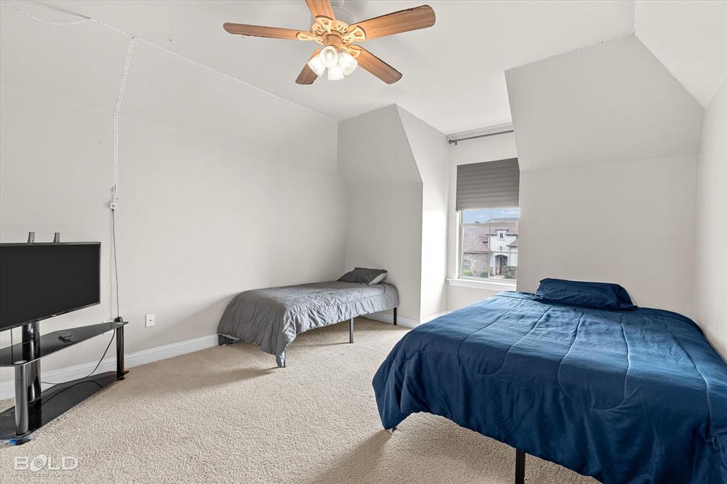 946 Maize Street Bossier City, LA 71111 - Photo 38 of 39 a bedroom with a bed flat screen tv and window