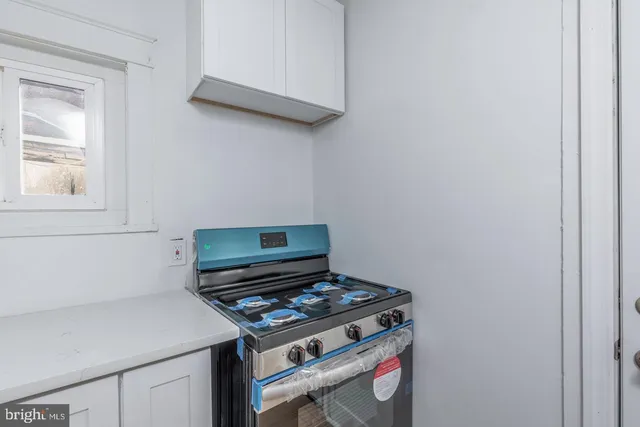 a kitchen with a sink and refrigerator