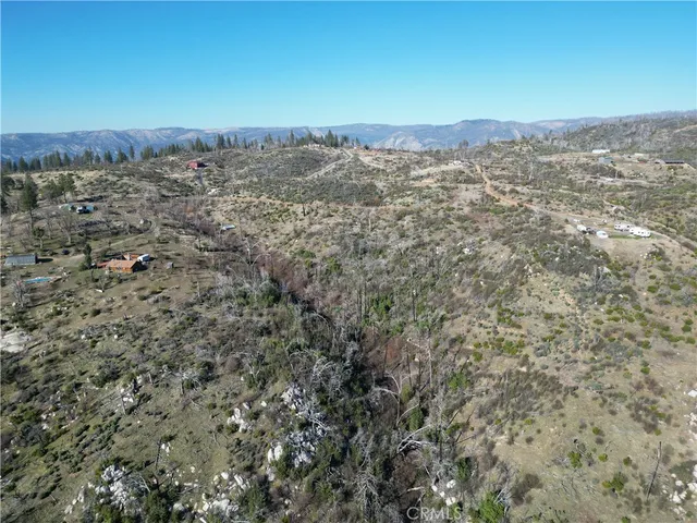 a view of a large building with a mountain in the background