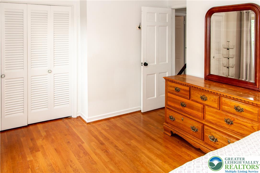 3582 Country Club Road Easton, PA 18045 - Photo 34 of 48 Natural wood floors and crisp white walls define this inviting and adaptable bedroom space.