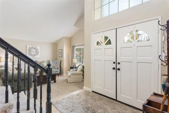 a view of an entryway with wooden floor