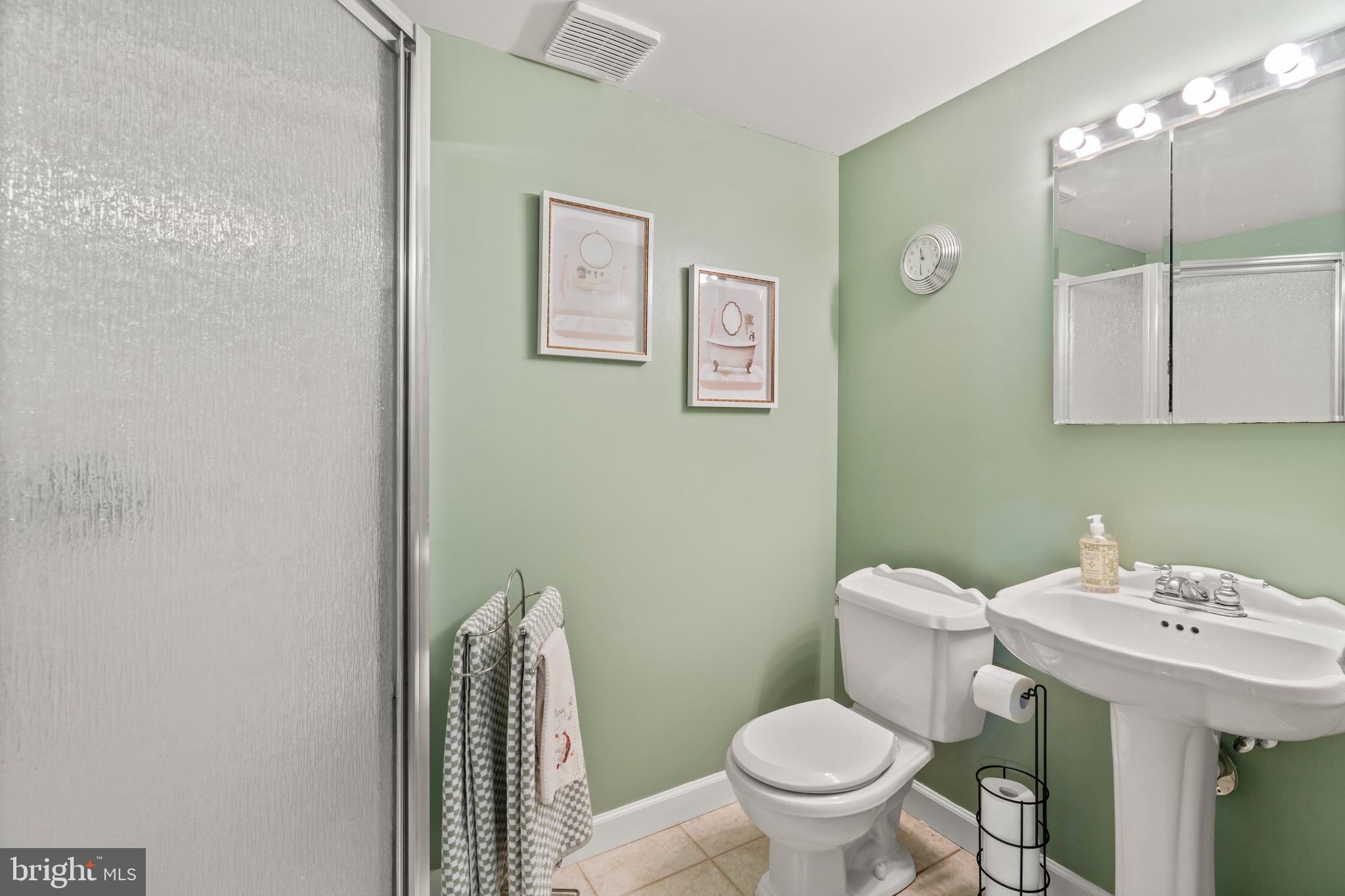 14 Stable Gate Court Perry Hall, MD 21128 - Photo 14 of 46 a bathroom with a toilet a sink and mirror