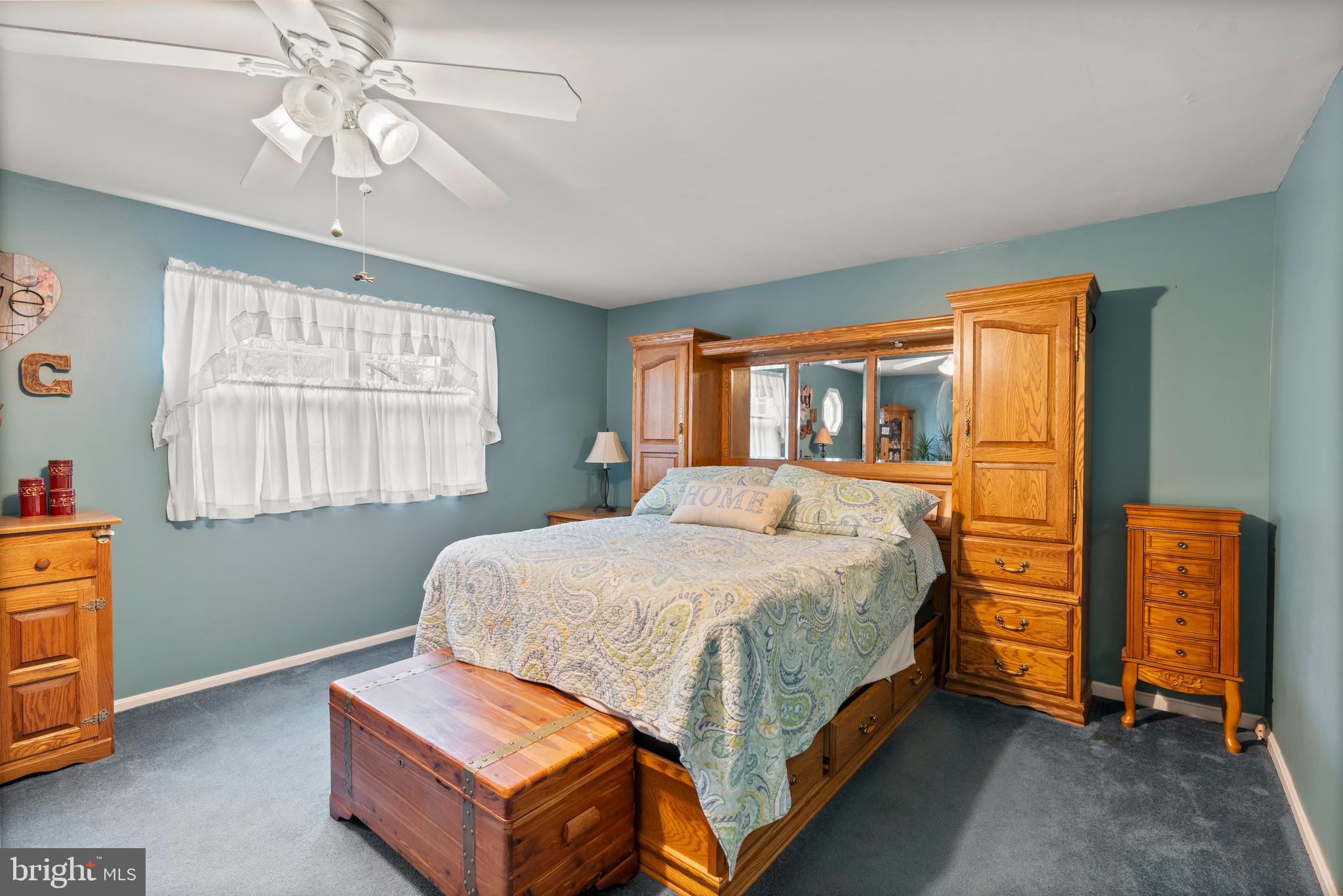 14 Stable Gate Court Perry Hall, MD 21128 - Photo 16 of 46 a bedroom with a bed and a chandelier