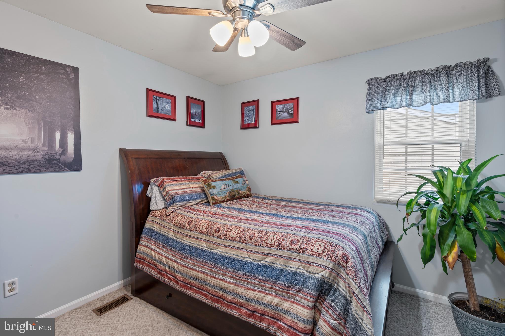 14 Stable Gate Court Perry Hall, MD 21128 - Photo 18 of 46 a bedroom with bed and a chandelier