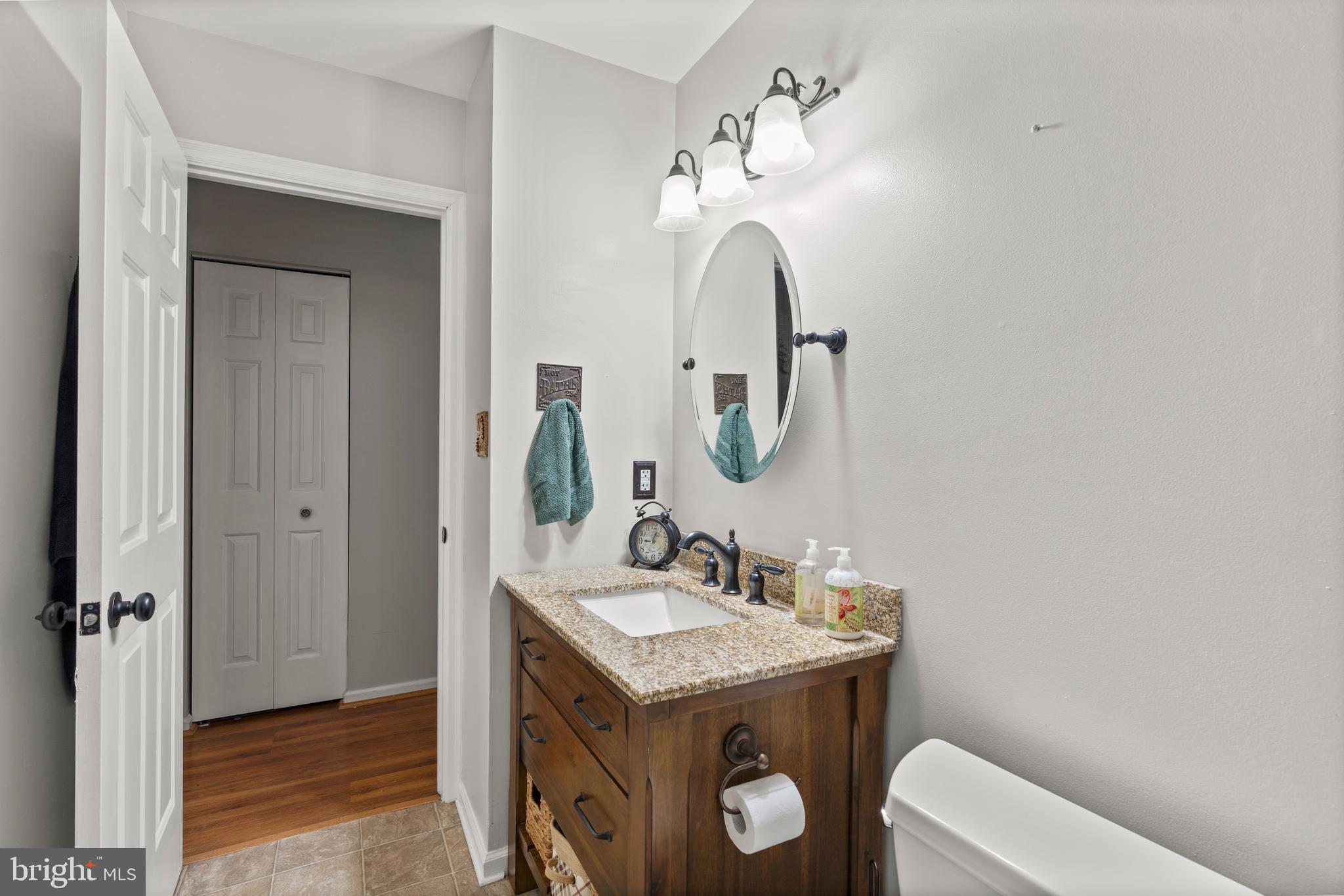 14 Stable Gate Court Perry Hall, MD 21128 - Photo 19 of 46 a bathroom with a sink toilet and mirror