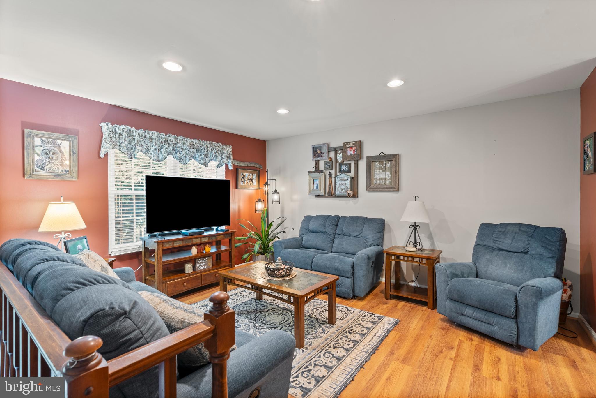 14 Stable Gate Court Perry Hall, MD 21128 - Photo 2 of 46 a living room with furniture and a flat screen tv