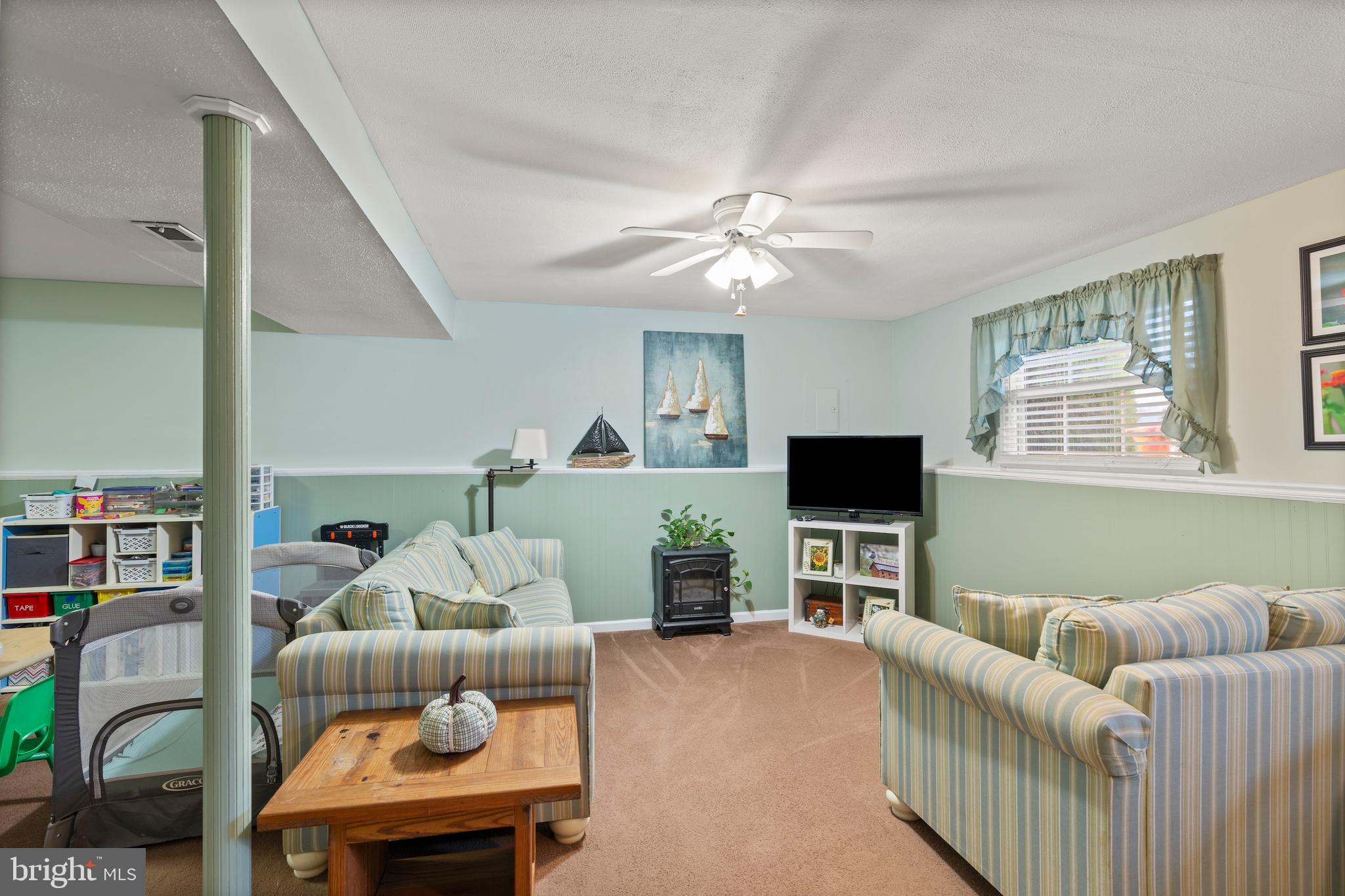 14 Stable Gate Court Perry Hall, MD 21128 - Photo 21 of 46 a living room with furniture and a flat screen tv
