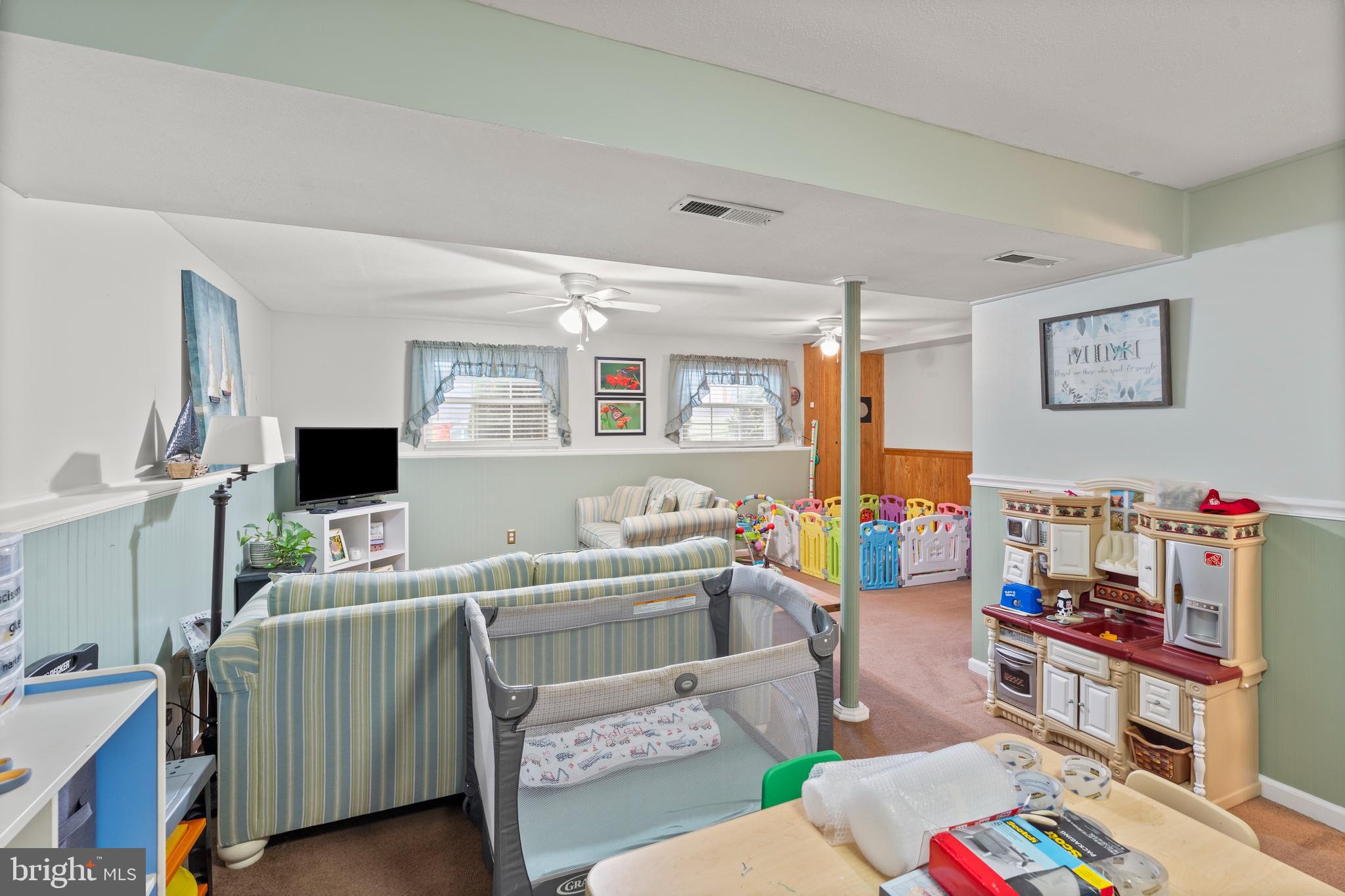 14 Stable Gate Court Perry Hall, MD 21128 - Photo 24 of 46 a room with furniture a rug and a flat screen tv
