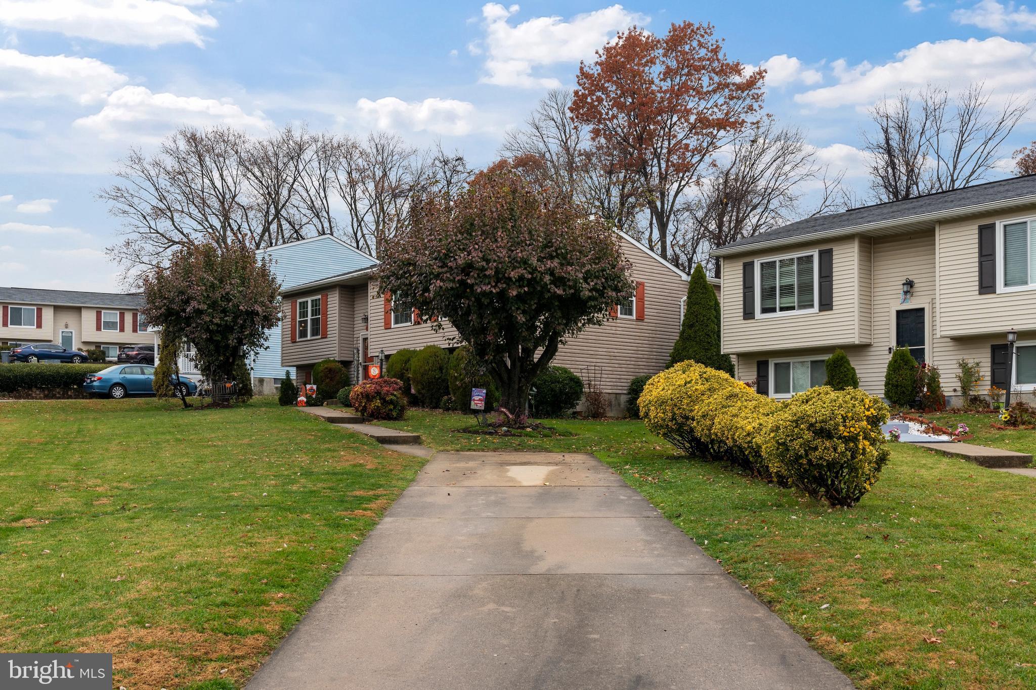 14 Stable Gate Court Perry Hall, MD 21128 - Photo 32 of 46 a front view of a house with a garden and trees