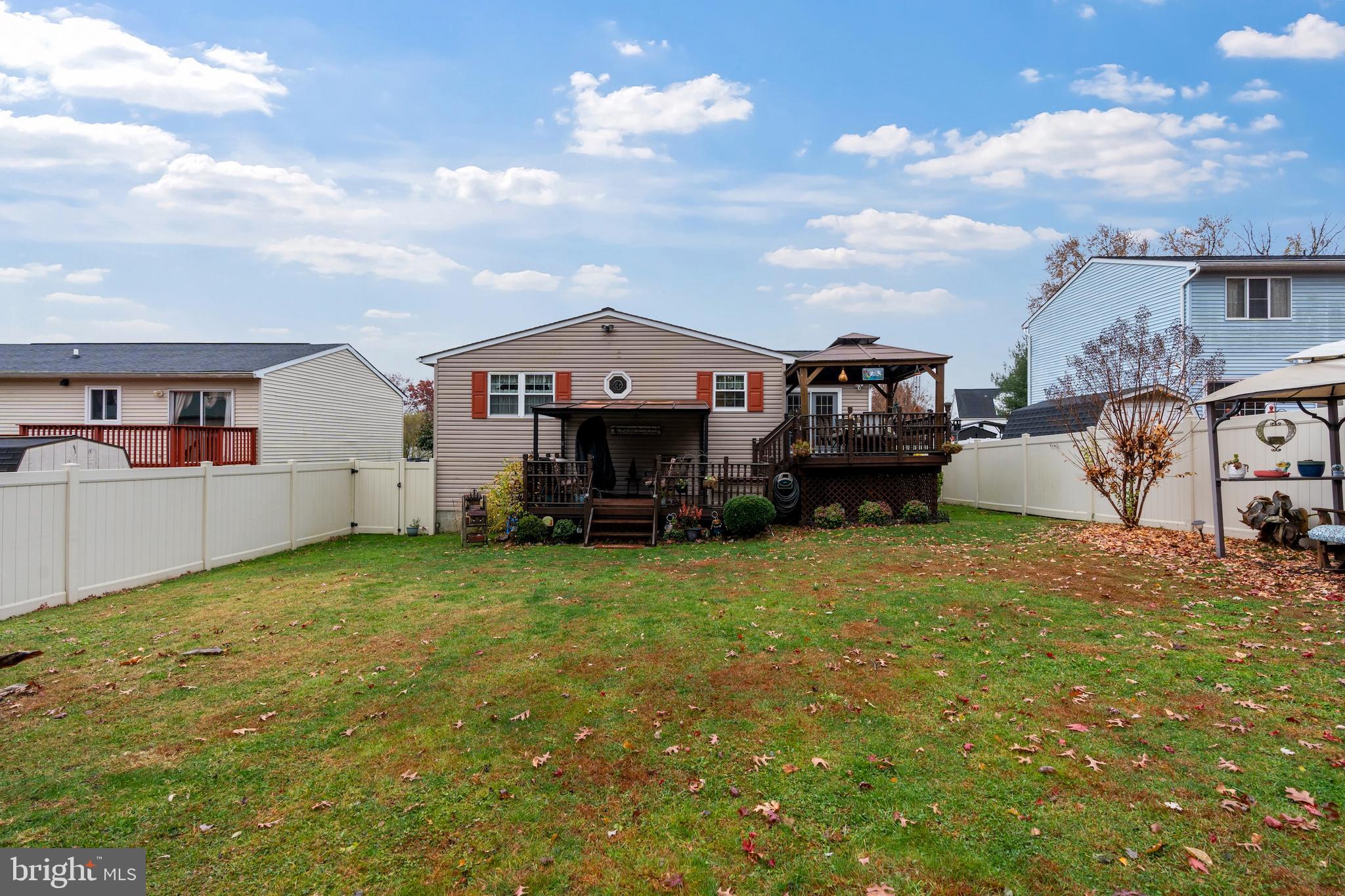 14 Stable Gate Court Perry Hall, MD 21128 - Photo 33 of 46 a front view of a house with a garden and deck